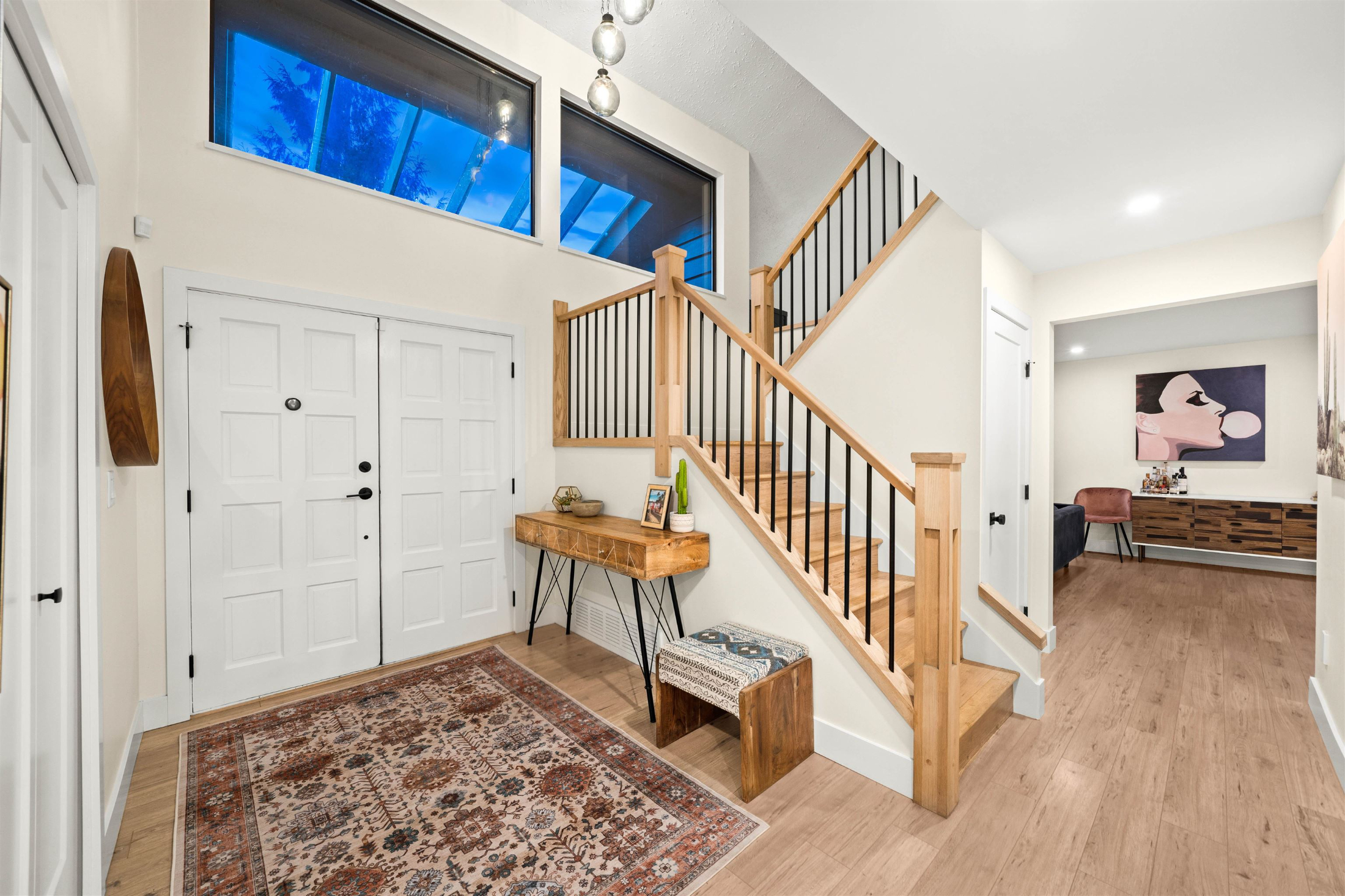 Entrance foyer, featuring baseboards, recessed lighting, wood finished floors, and stairway