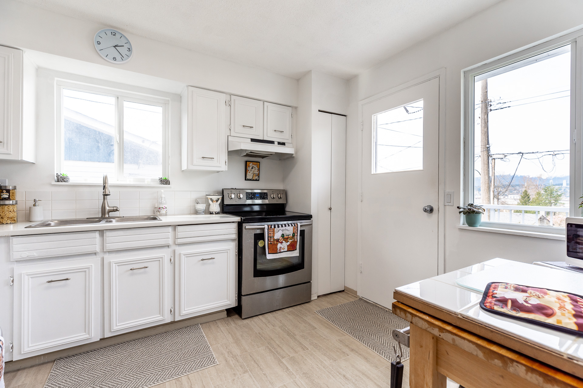 Panoramic Fraser River and mountain views from living room window at 13414 113 Ave