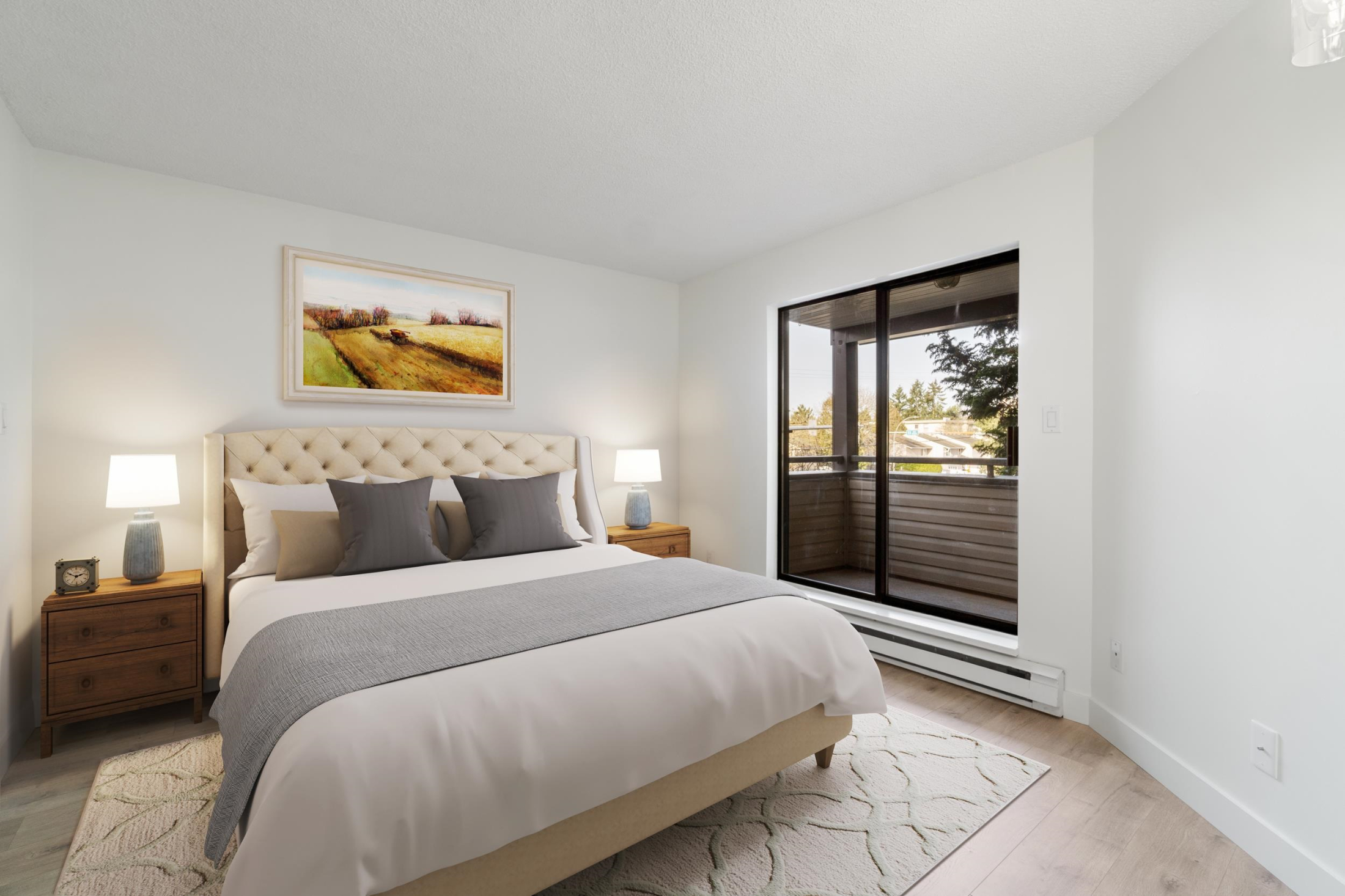 Bedroom with access to exterior, a baseboard heating unit, light wood style floors, and baseboards