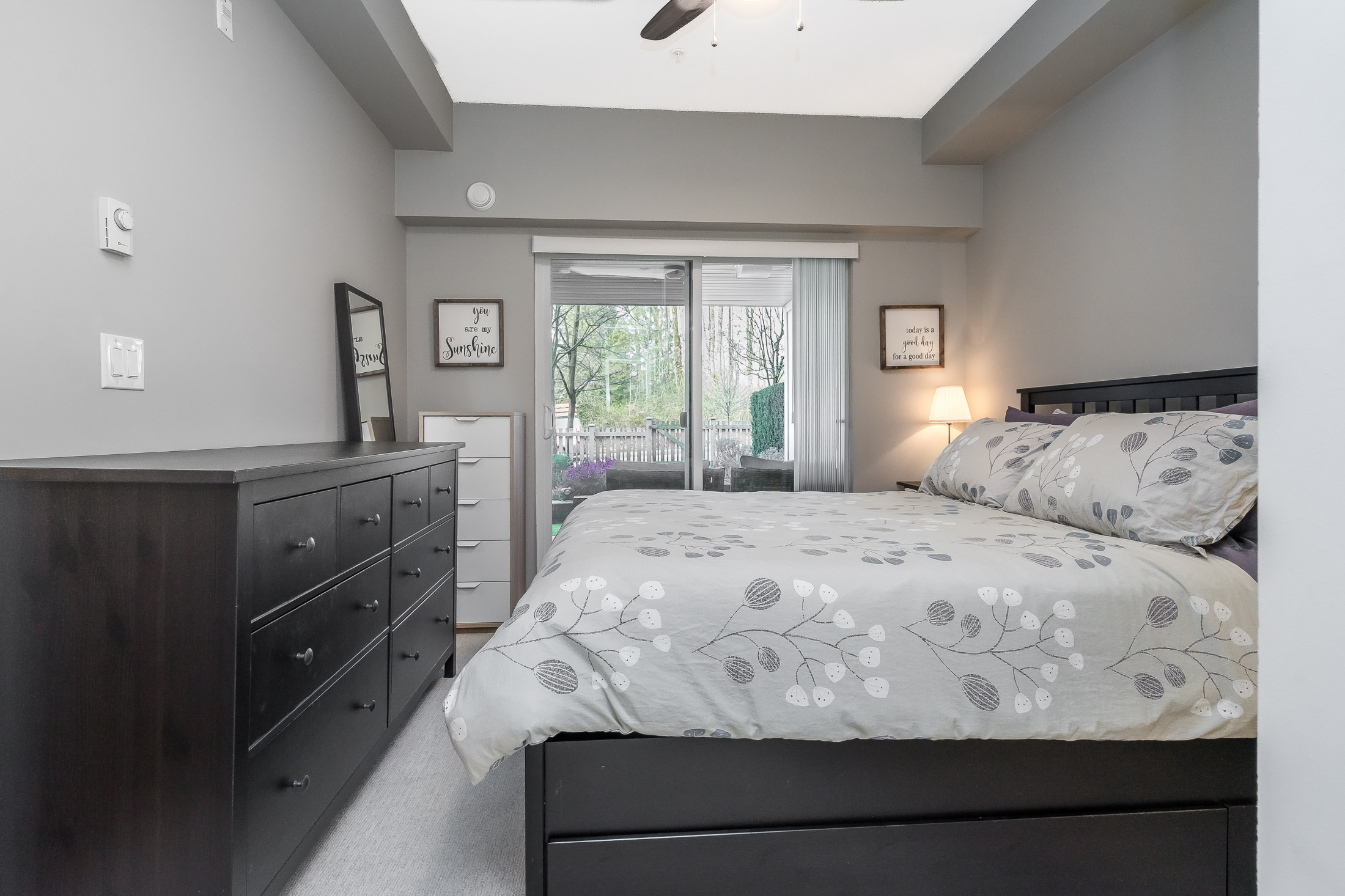 Cozy bedroom with patio access and modern decor.