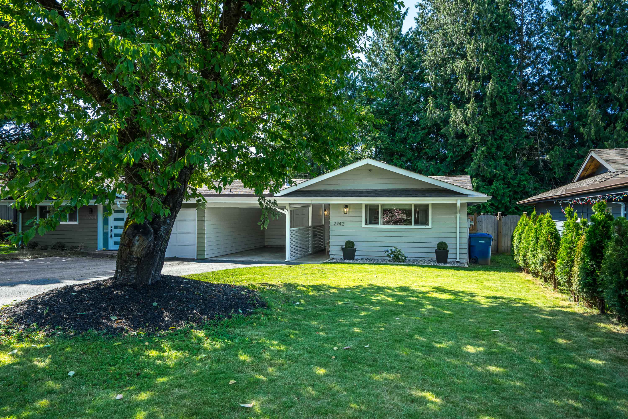 Front view with wide front yard