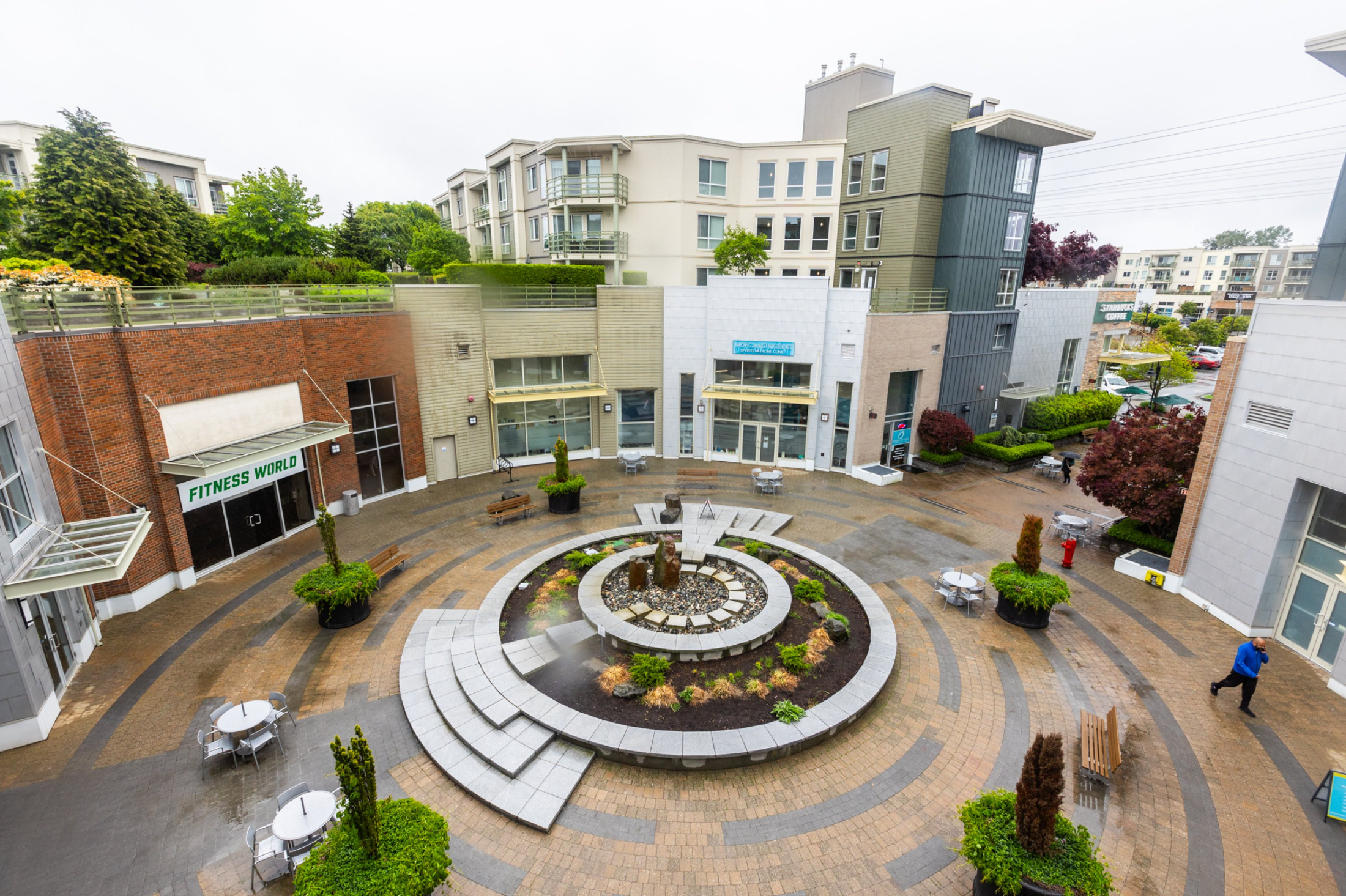Exterior view of Morgan Crossing complex with shops and residential units