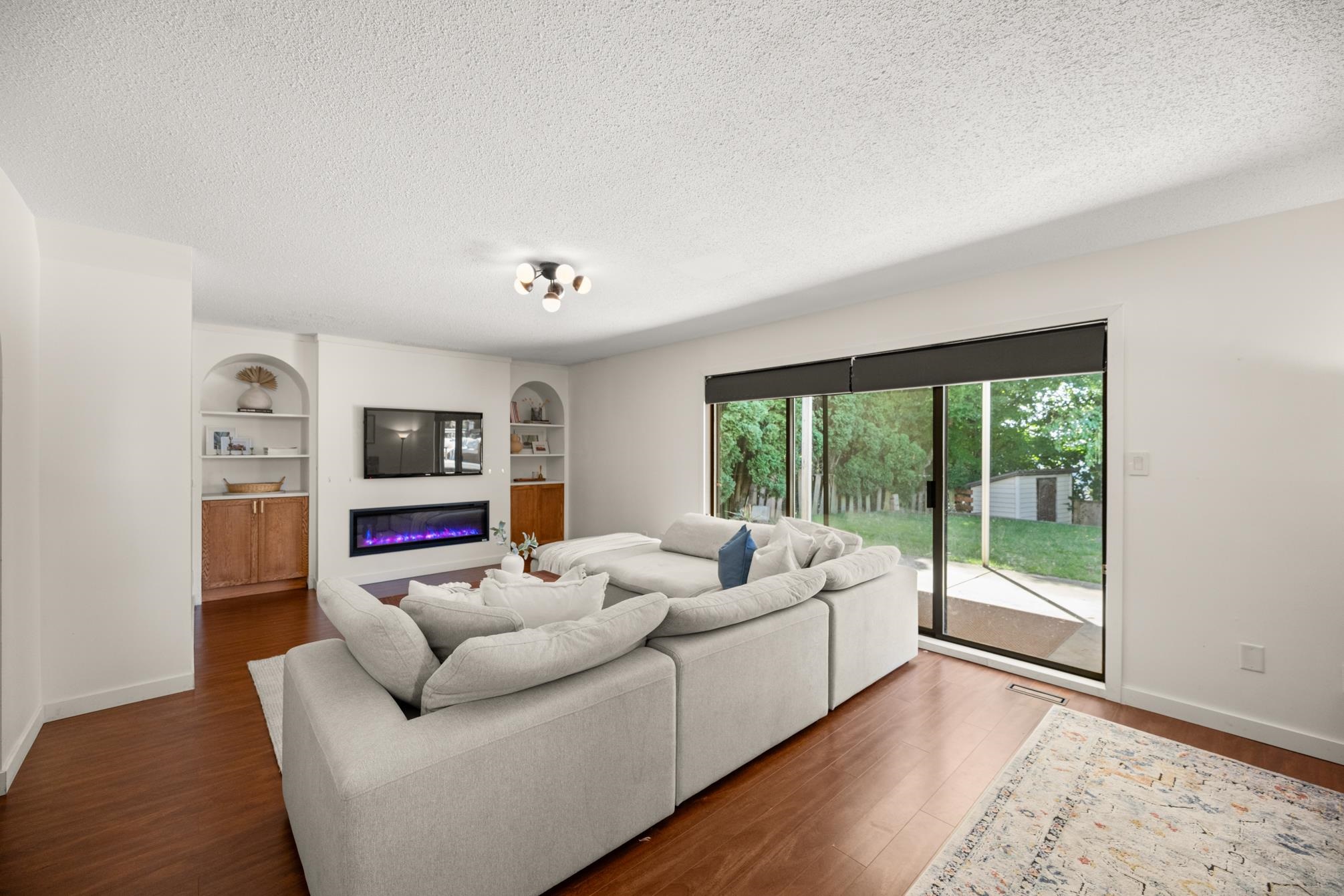 Wide living room with large windows