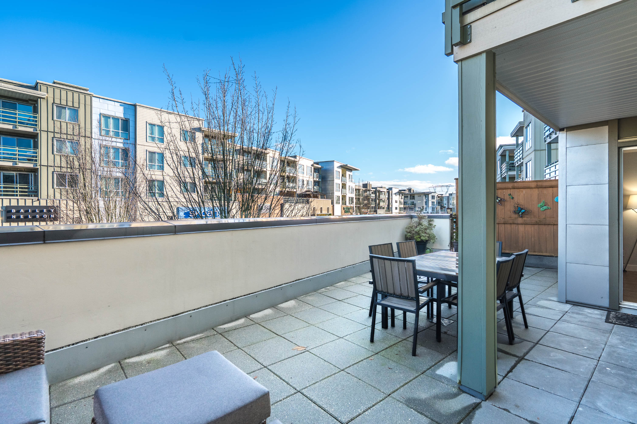 Outdoor patio of a condo unit at The Main at Morgan Crossing, South Surrey