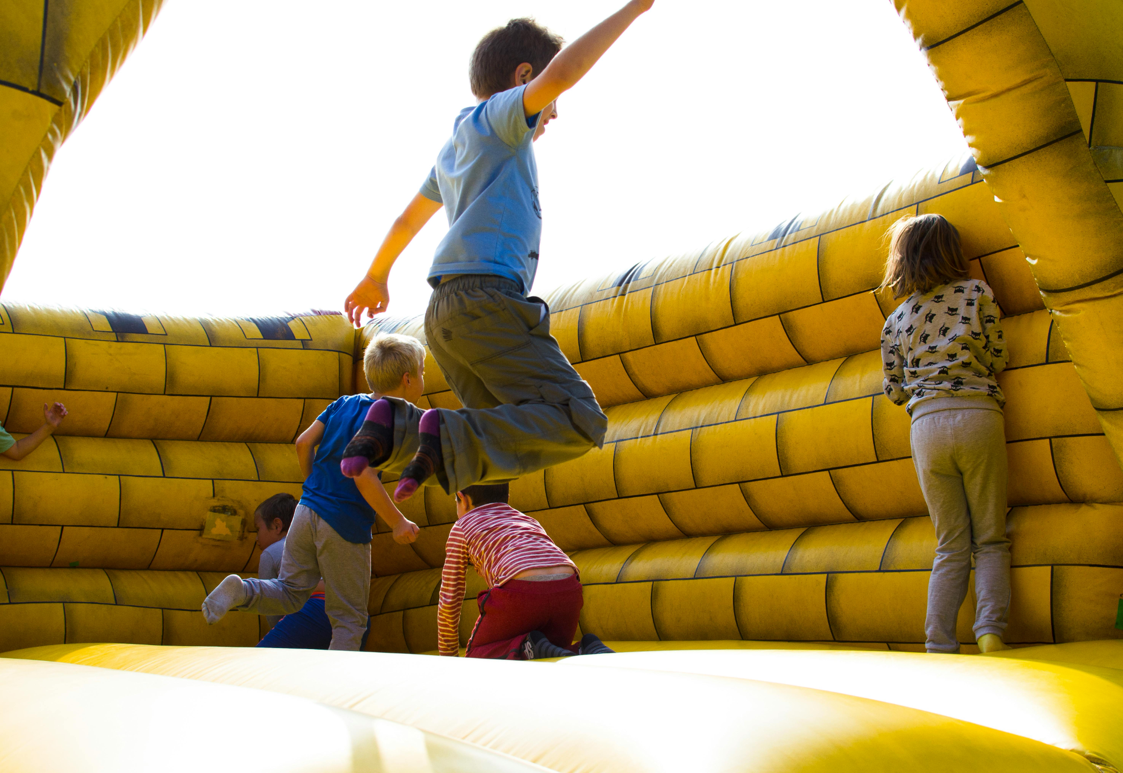 Kids playing bouncy castle Family Day