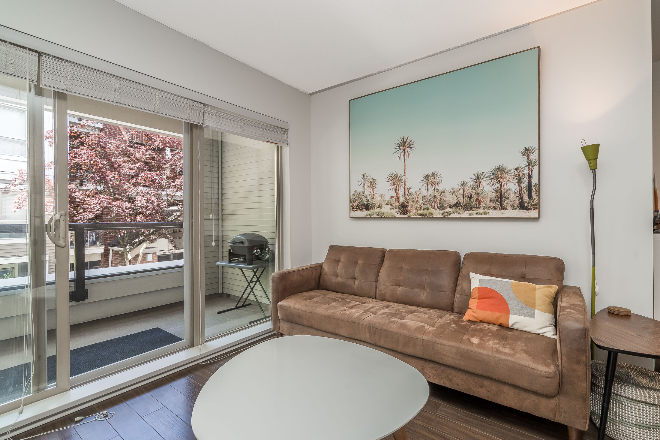 Bright open-concept living room in 1 bed plus den condo at The Grove, Langley