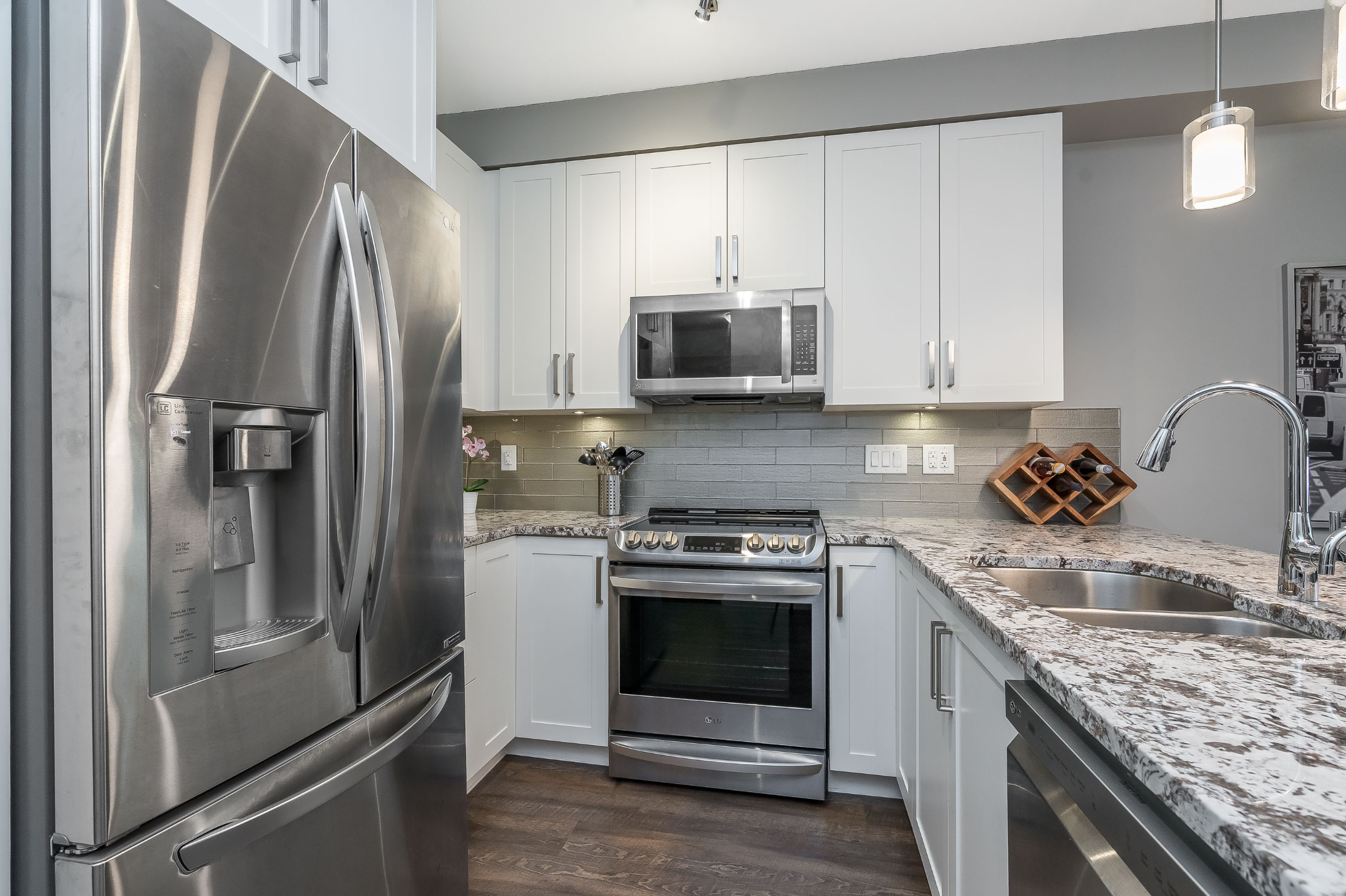 Compact kitchen with high-end stainless steel finishes.