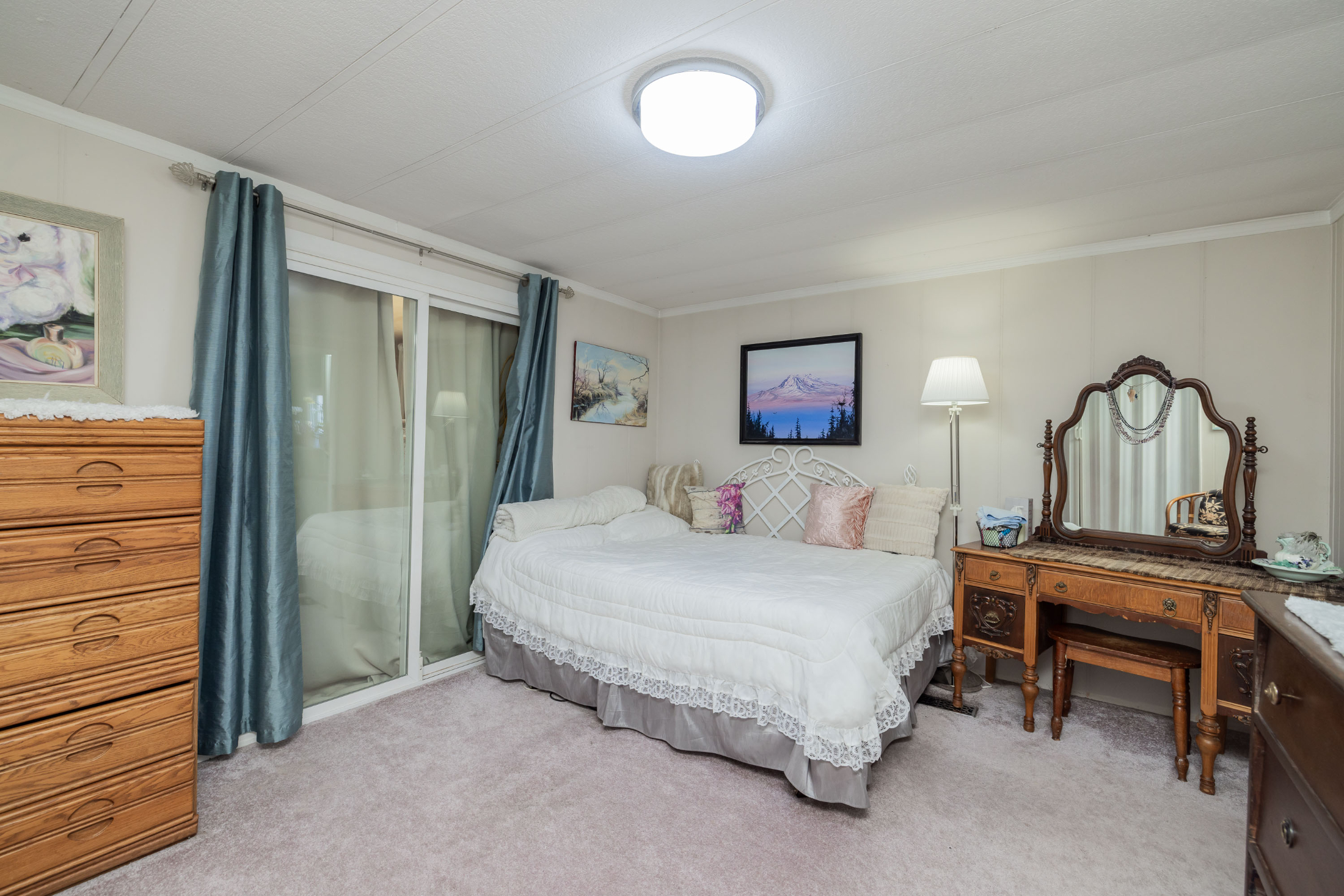 Carpeted bedroom with crown molding and access to outside